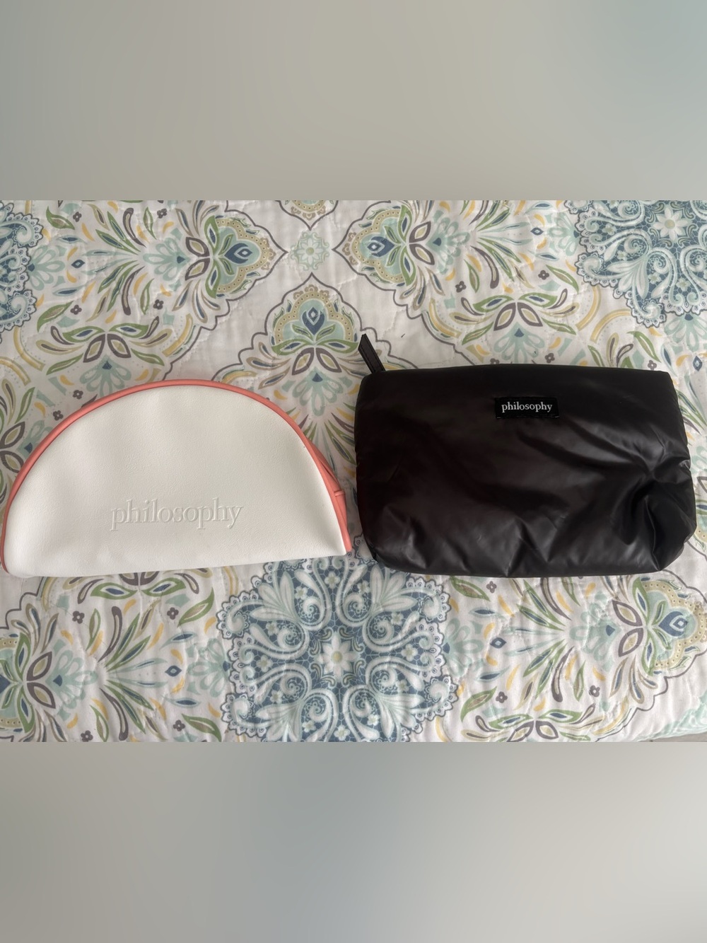 Bundle of Philosophy cosmetic bags -
Zip enclosure